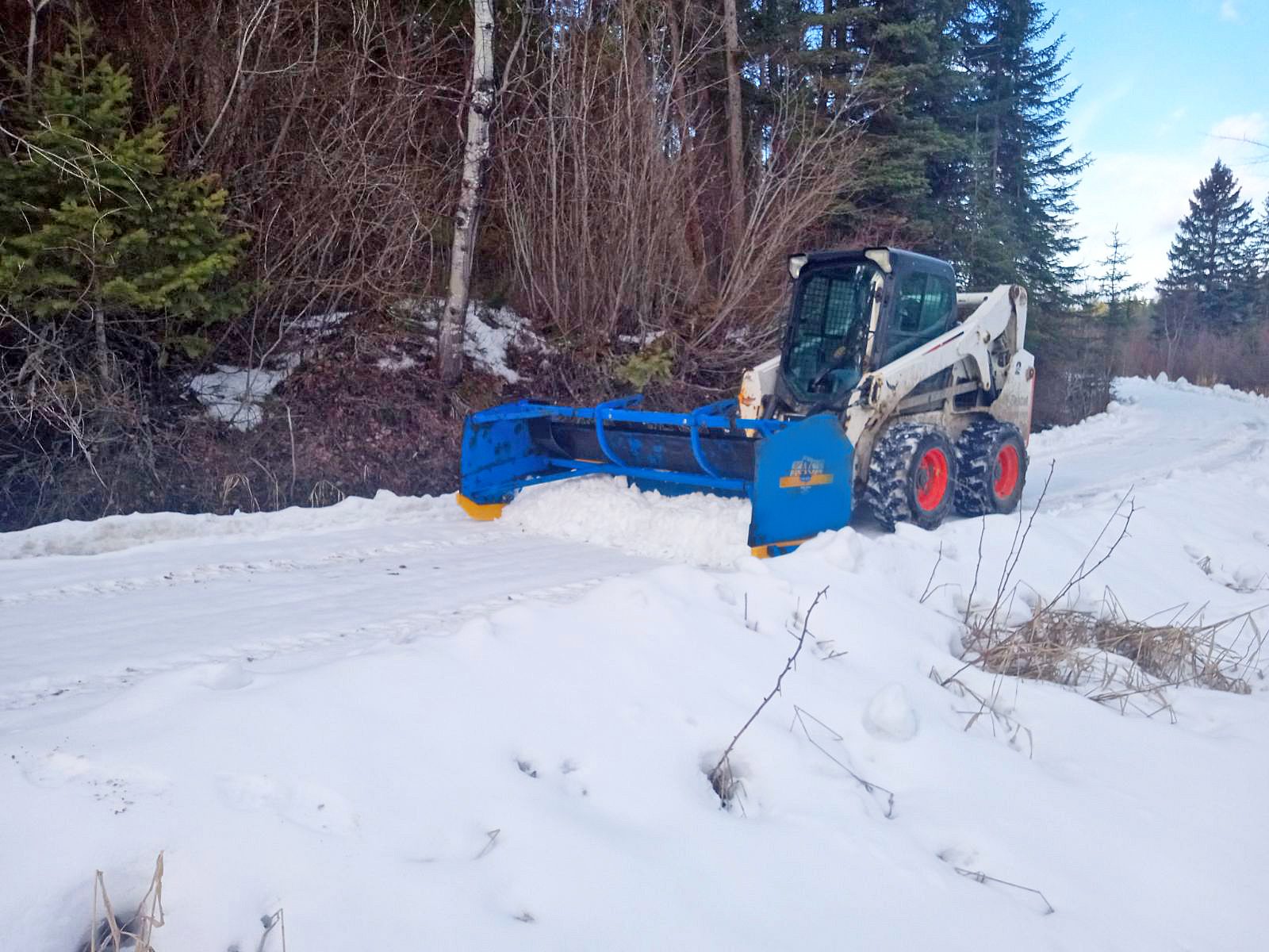 Skid Steer and KAGE Plow clearing Bar W Ranch