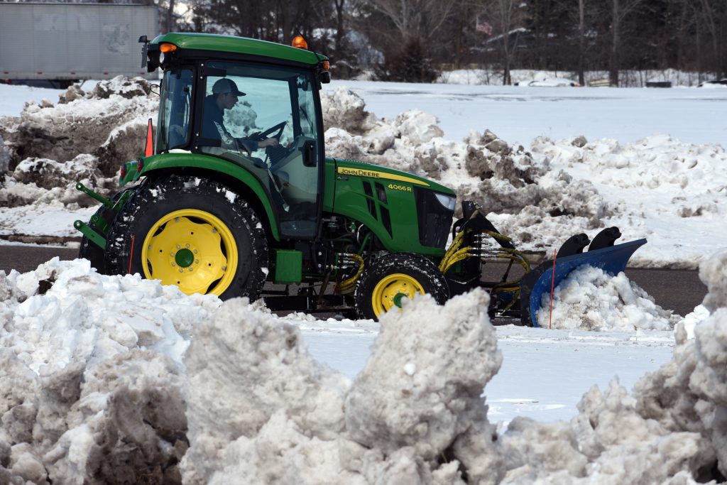 8000 Series KAGE Under-Hitch Tractor Undercarriage with SnowFire Snow Blade Plowing Snow